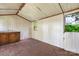 Interior view of the outbuilding featuring cabinets, countertops, lighting, and two windows at 3418 Sulphur Springs Ne Rd, Hickory, NC 28601