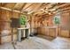 Outbuilding with partially finished interior, exposed wood frame, and pegboard organizer at 3418 Sulphur Springs Ne Rd, Hickory, NC 28601