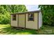 Exterior of the outbuilding featuring two windows, and a door, and an area for a small deck at 3418 Sulphur Springs Ne Rd, Hickory, NC 28601