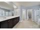 Large bathroom featuring double sink vanity, ceramic tile floor, glass enclosed shower, and natural light at 3426 Richards Xing, Fort Mill, SC 29708