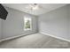 Cozy bedroom featuring neutral carpet, ceiling fan and natural light from the single window at 3426 Richards Xing, Fort Mill, SC 29708