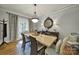 Inviting dining room featuring a wooden table, comfortable chairs, and natural light from a nearby window at 3426 Richards Xing, Fort Mill, SC 29708