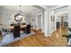 Formal dining room with hardwood floors, elegant lighting, and a stylish mirror above a classic buffet at 3426 Richards Xing, Fort Mill, SC 29708