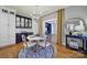 Elegant dining room featuring white and blue cabinets and a stylish chandelier at 3426 Richards Xing, Fort Mill, SC 29708