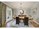 Elegant dining room showcasing hardwood floors, neutral walls, and a stylish dining table with seating for six at 3426 Richards Xing, Fort Mill, SC 29708