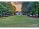 A classic building framed by lush trees and a spacious lawn, creating a peaceful and inviting environment at 3426 Richards Xing, Fort Mill, SC 29708