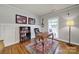Comfortable home office featuring a wooden desk, bookshelf, and a large window with natural light at 3426 Richards Xing, Fort Mill, SC 29708