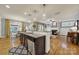 Open kitchen island with a view to a living room featuring a fireplace at 3426 Richards Xing, Fort Mill, SC 29708