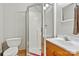 Clean bathroom features a glass shower, toilet, and wood vanity at 3690 Birchwood Ln, Denver, NC 28037
