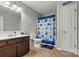 Bathroom with vanity, mirror, toilet and shower/tub combination with nautical themed decor at 3690 Birchwood Ln, Denver, NC 28037