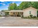 Charming single-story home with a covered porch, manicured landscaping and a welcoming entrance at 3690 Birchwood Ln, Denver, NC 28037