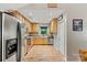 Functional kitchen featuring stainless steel appliances, ample cabinet space, and a bright window at 3690 Birchwood Ln, Denver, NC 28037
