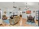 Spacious living room with vaulted ceiling, hardwood floors, and neutral decor, seamlessly connecting to the dining area at 3690 Birchwood Ln, Denver, NC 28037