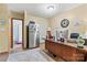 Bright office space features a large desk, stainless steel refrigerator, and tile floors at 3690 Birchwood Ln, Denver, NC 28037