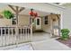 Welcoming front porch with hanging flower baskets and a charming 'Hello Sunshine' sign at 3690 Birchwood Ln, Denver, NC 28037