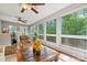 Bright sunroom with many windows offering peaceful views and comfortable seating at 3690 Birchwood Ln, Denver, NC 28037