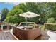 Well maintained back deck with outdoor seating and mature tree canopy at 3918 Rea Rd, Charlotte, NC 28226