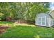 Backyard featuring an outbuilding, a chicken coop, and a swing at 3918 Rea Rd, Charlotte, NC 28226
