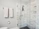 Modern bathroom features include a glass shower with marbled tile and black hexagon floor tiles at 3918 Rea Rd, Charlotte, NC 28226