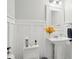 Elegant half bath with a stylish pedestal sink and modern fixtures offers convenience and charm for guests at 3918 Rea Rd, Charlotte, NC 28226