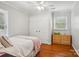 Cozy bedroom with hardwood floors, a ceiling fan and a double door closet at 3918 Rea Rd, Charlotte, NC 28226