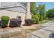 A brick exterior with well-maintained landscaping and a paved driveway, adding curb appeal at 3918 Rea Rd, Charlotte, NC 28226