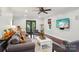 Bright living room with hardwood floors, ceiling fan, and a cozy seating area perfect for relaxing and entertaining at 3918 Rea Rd, Charlotte, NC 28226