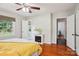 Cozy main bedroom features hardwood floors, a decorative fireplace, and a comfortable bed for relaxation at 3918 Rea Rd, Charlotte, NC 28226