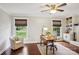 Bright office space with natural light, hardwood floors, and charming built-in bookshelves perfect for remote work at 3918 Rea Rd, Charlotte, NC 28226