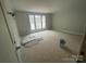 Bright bedroom with three large windows, offering ample natural light at 4021 Grommet Ct # 4, Matthews, NC 28105