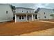 Charming two-story home featuring a welcoming front porch with classic white columns at 4021 Grommet Ct, Matthews, NC 28105