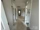 Long hallway with doors and staircase at 4021 Grommet Ct, Matthews, NC 28105