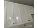 Close up of new white kitchen cabinets with matte black handles at 4021 Grommet Ct, Matthews, NC 28105