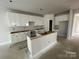 Spacious kitchen featuring white cabinets and a center island at 4021 Grommet Ct # 4, Matthews, NC 28105