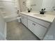 Modern bathroom featuring double vanity, stylish fixtures, and a tub with shower at 4021 Grommet Ct, Matthews, NC 28105