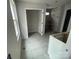 Bathroom featuring neutral tile flooring and a tiled shower being installed, highlighting a modern design at 4021 Grommet Ct, Matthews, NC 28105