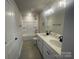 Bathroom featuring double vanity, stylish fixtures, and a tub with shower at 4021 Grommet Ct, Matthews, NC 28105
