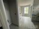 Bathroom showcasing a window for natural light, tiled floor, and tiled shower installation in progress at 4021 Grommet Ct, Matthews, NC 28105