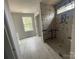 Bright bathroom with a tiled shower installation and large window providing natural light in a modern space at 4021 Grommet Ct, Matthews, NC 28105