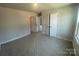Bright bedroom with ample closet space and neutral walls at 4021 Grommet Ct, Matthews, NC 28105
