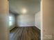 Bedroom featuring wood-look flooring, a neutral paint and natural light at 4021 Grommet Ct, Matthews, NC 28105