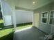 An inviting covered patio space, ideal for outdoor relaxation and entertainment, adjacent to a well-maintained backyard at 4021 Grommet Ct, Matthews, NC 28105