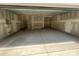Spacious two-car garage featuring concrete flooring and ample space for storage and vehicles at 4021 Grommet Ct, Matthews, NC 28105