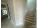 A home hallway with access to the upper stairs and bedrooms at 4021 Grommet Ct, Matthews, NC 28105