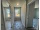 Hallway with natural lighting from the window and white walls at 4021 Grommet Ct, Matthews, NC 28105