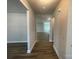 Hallway featuring wood-look flooring and an open concept design at 4021 Grommet Ct, Matthews, NC 28105