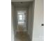 Hallway view leading to a bright room with a white-framed window, showcasing the home's layout and natural light at 4021 Grommet Ct, Matthews, NC 28105