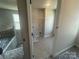Spacious laundry room with gray tile flooring and a window for natural light at 4021 Grommet Ct, Matthews, NC 28105