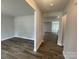 Living room featuring wood-look flooring and an open concept design at 4021 Grommet Ct, Matthews, NC 28105