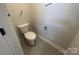 A clean and simple toilet area maximizing space with a compact design, perfect for a functional bathroom layout at 4021 Grommet Ct, Matthews, NC 28105